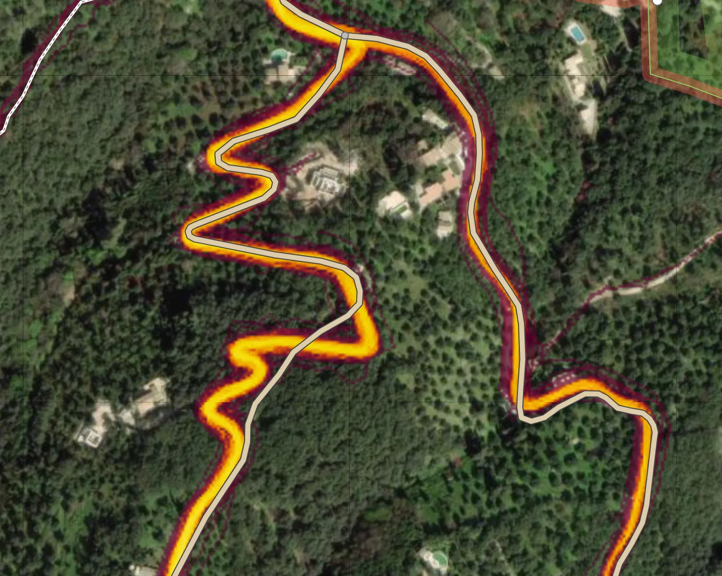 A trail (aerial image with Strava heatmap) with some paths slightly misaligned and one that is missing a curve