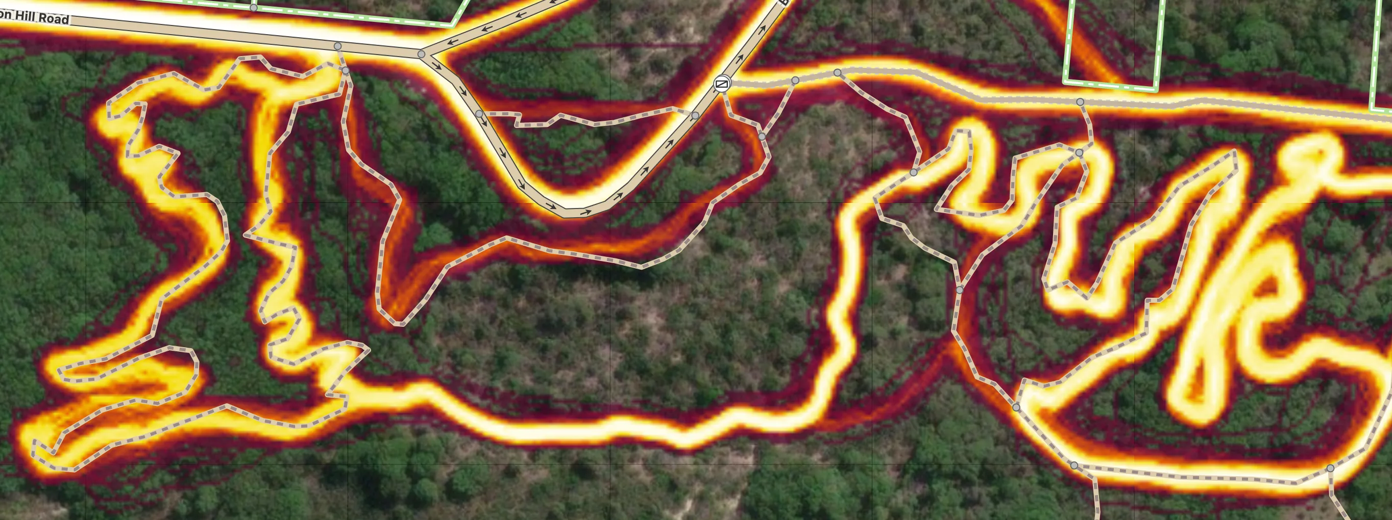 A dirtbiking course (aerial image with Strava heatmap) with many of the curves needing to be smoothed out and aligned and some paths missing