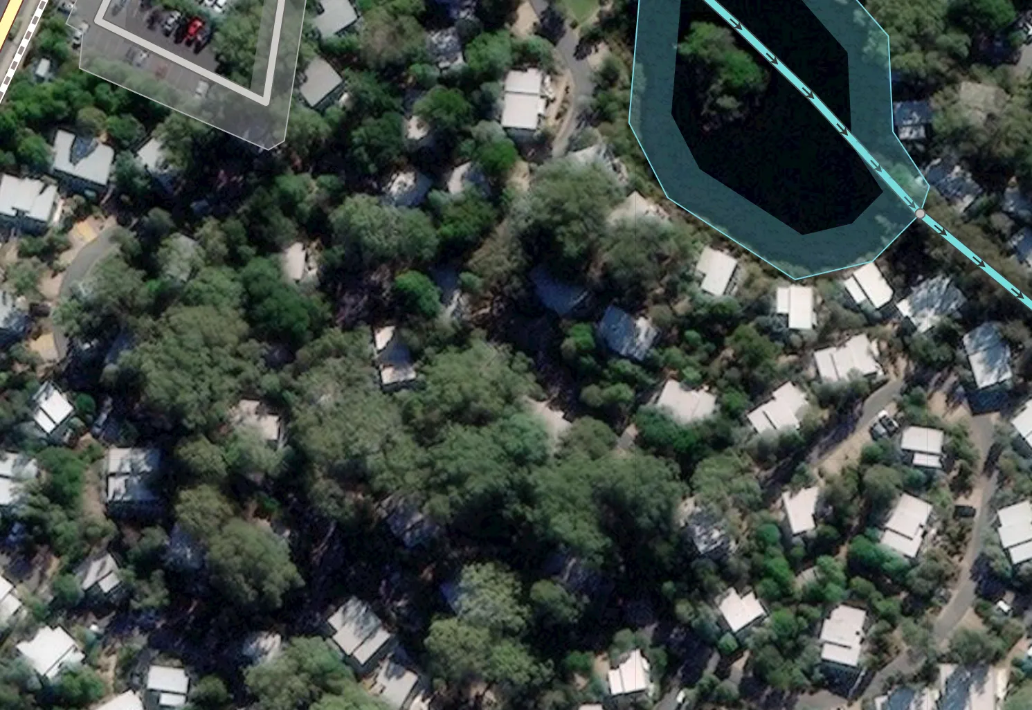 A residential area (aerial image) that is hard to make out because of tree coverage